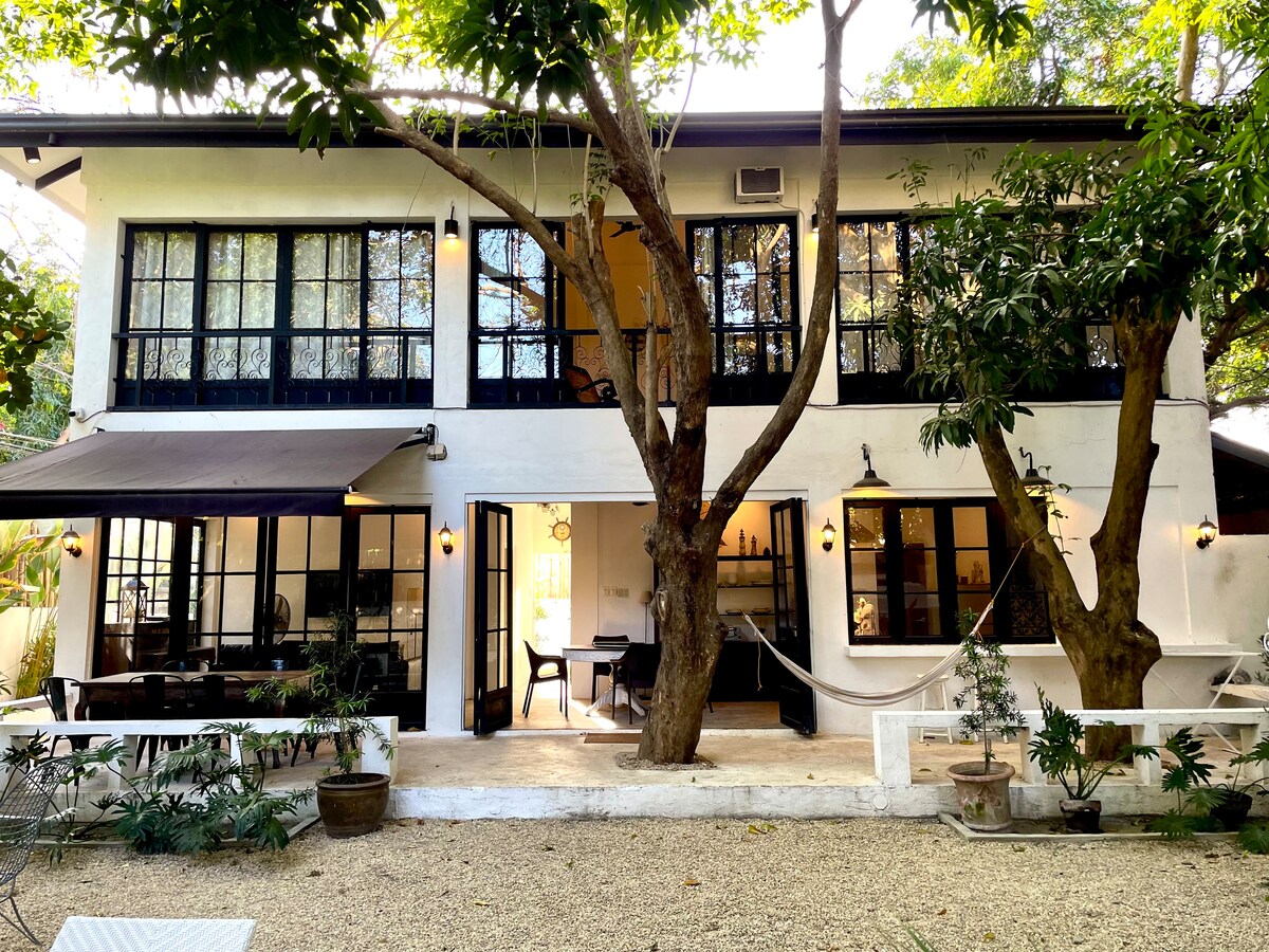 Casa Uno exterior facade with mango trees